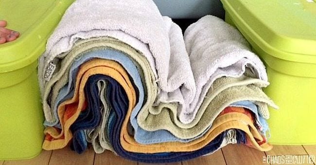 Pile of different colored towels pushed together to create folds like mountains