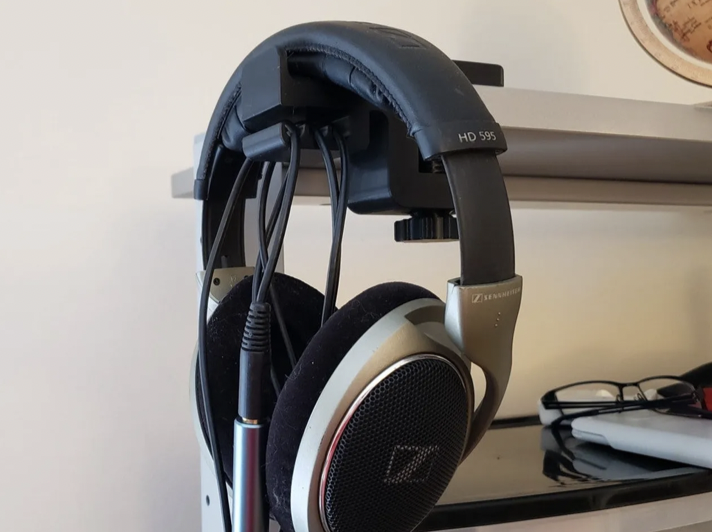 Desk mounted black headphones holder