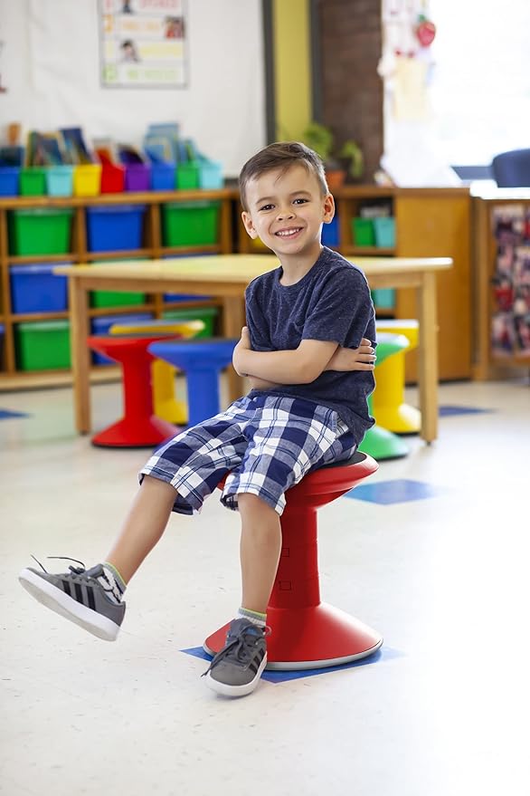 Young boy sitting on a wiggle stool