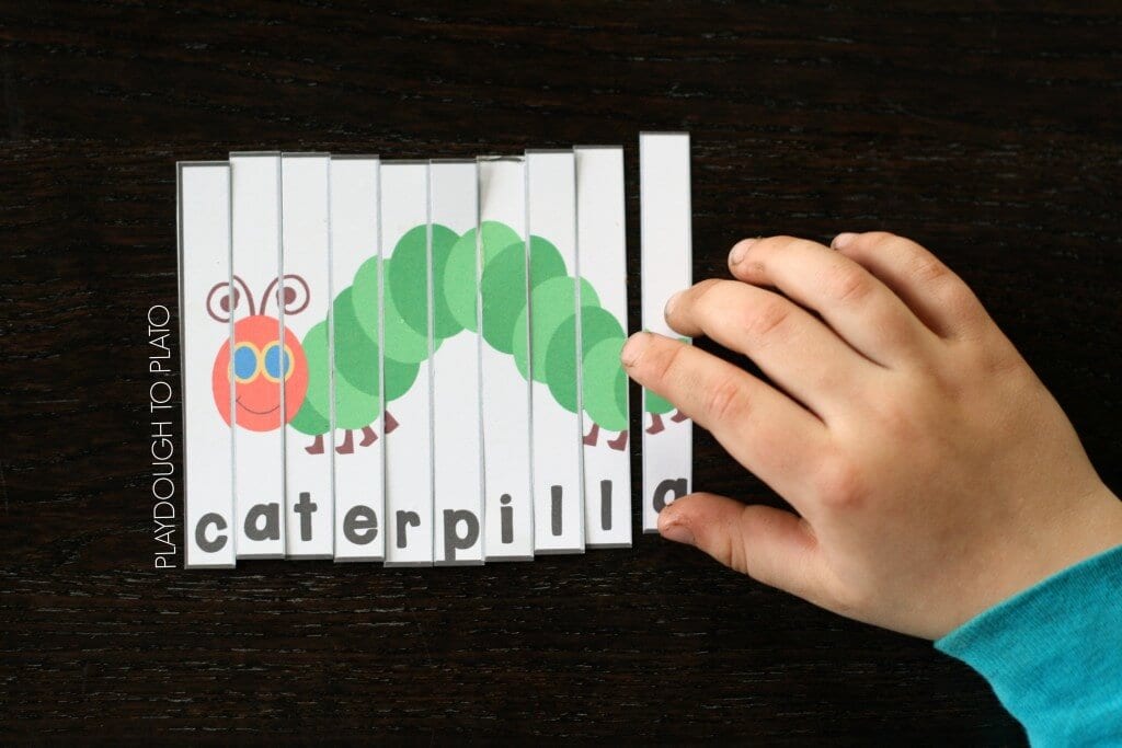 Strips of paper are pieced together to show a caterpillar.