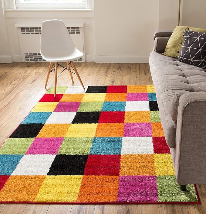 A rug is made up of rainbow colored squares. 