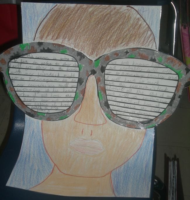 A student writing sample with an illustration of the student wearing large sunglasses as an example of end of year activities