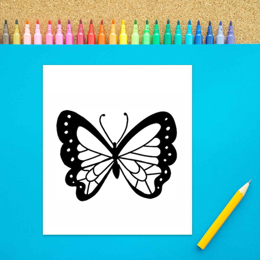 A black body with an oval and three black circles is shown with two long antennae coming off of it. Two wings have detailed designs inside of them in this fifth step of how to draw a butterfly. In this version the outer edges of the wings are shaded black. It is black marker on a white background.