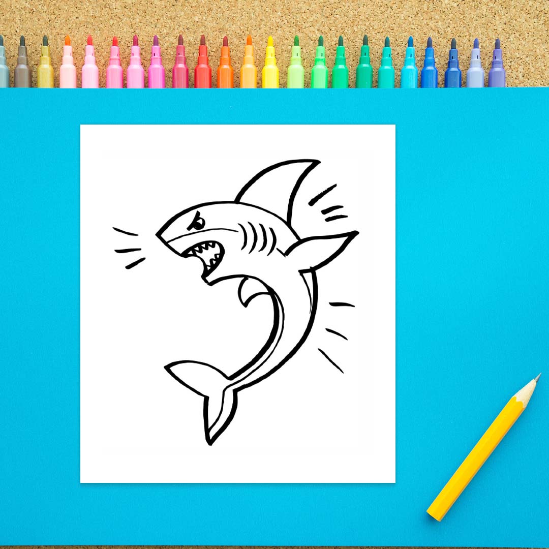 An angry looking shark is drawn with black marker on a white background. There are fins, a face, a tail, and several lines around the shark to emphasize movement. 