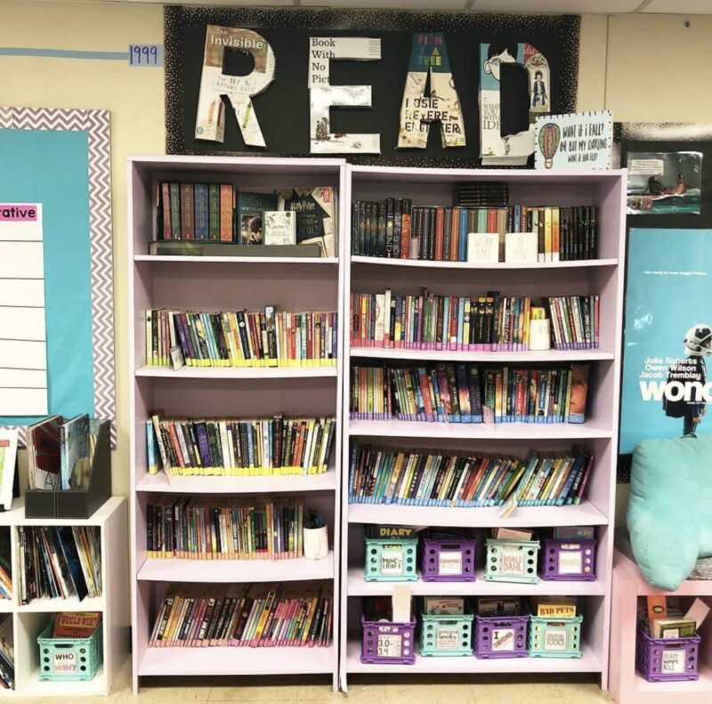 R E A D letters decorated in book covers above a book shelf 