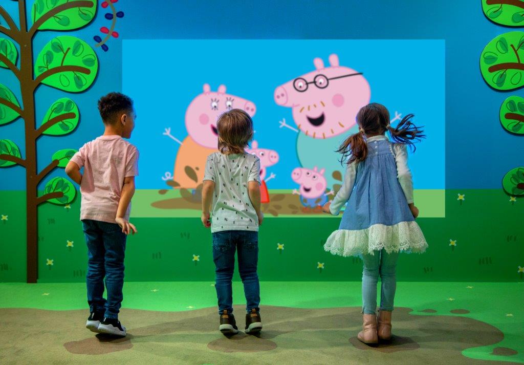 Three young students playing at Peppa Pig World of Play