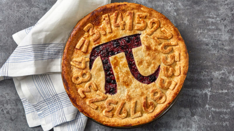 A beautifully baked pie with the pi symbol cut from the middle