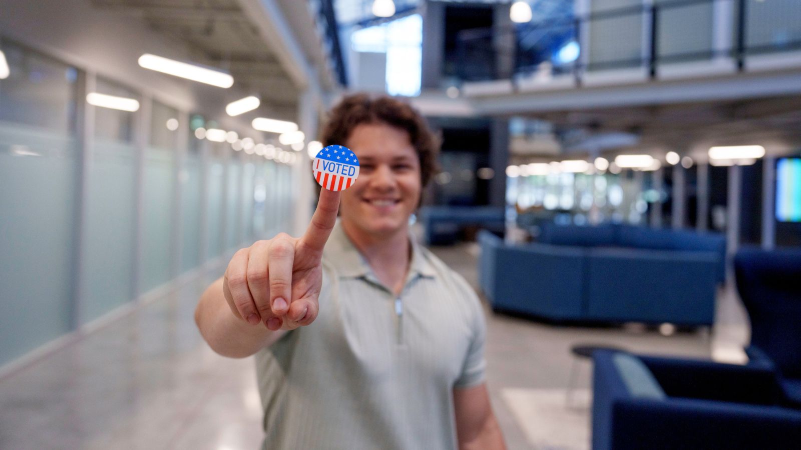 Student with sticker to teach the 2024 election