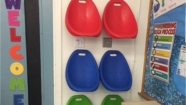 Image of scoop rockers hanging on wall in classroom