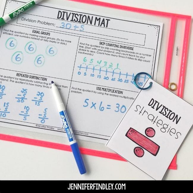 Division Mat worksheet in a sheet protector with markers