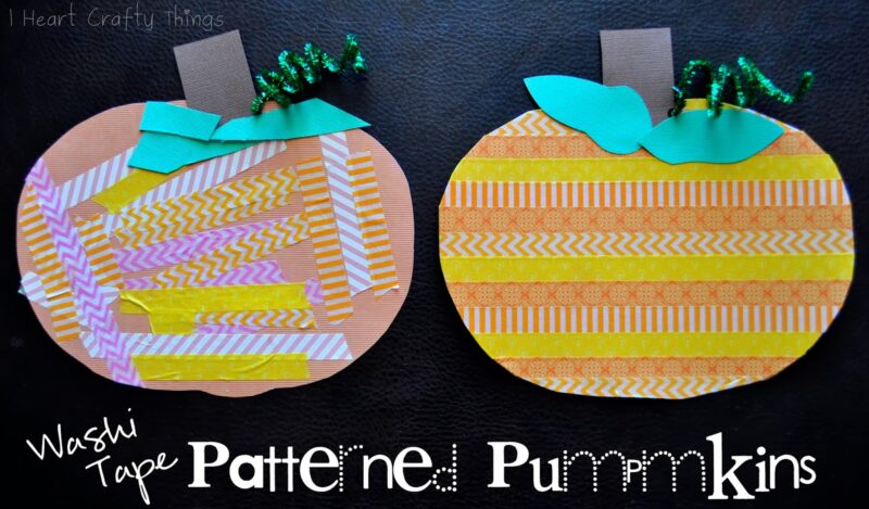 Two pumpkin cutouts are decorated with patterned tape. 