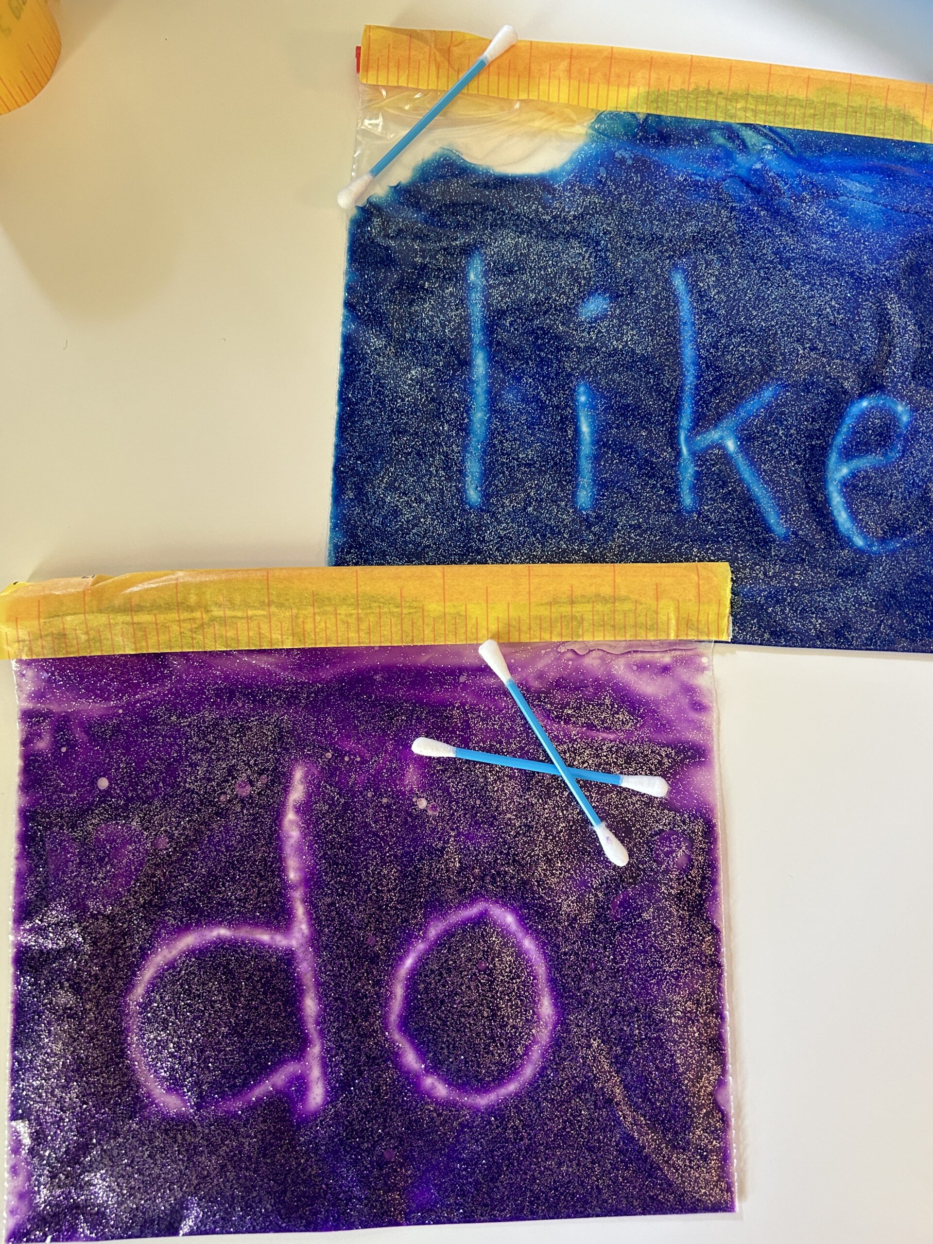 Write words on a sensory bag