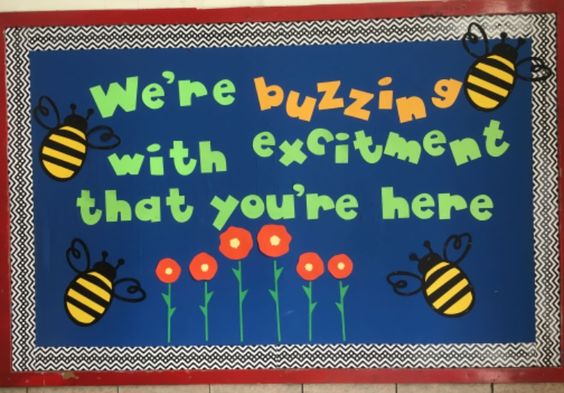 A bulletin board features bees and says we're buzzing with excitement that you're here.