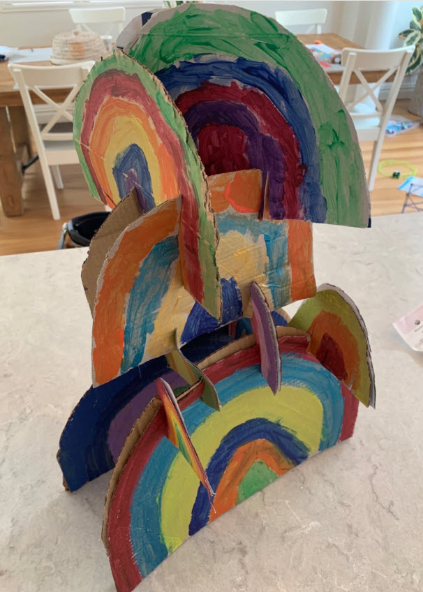 Stack of cardboard rainbows forming a small tower