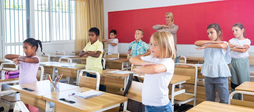 Kids doing exercises in the classroom as an example of pi day activities