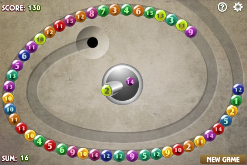 Screenshot of online math game showing spiral of numbered beads and a central number ball shooter
