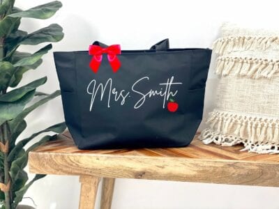 Personalized name teacher tote bag in black with apple