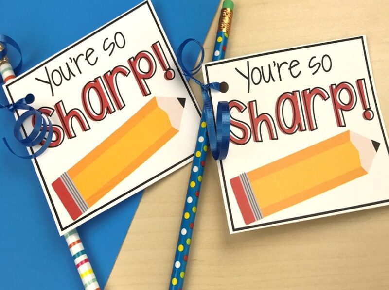 End of year student gifts of colorful pencils with a gift tag attached 