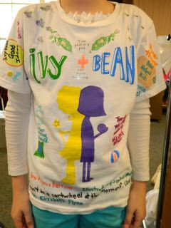 A student wears a colorful t-shirt decorated with a book report about the book Ivy and Bean