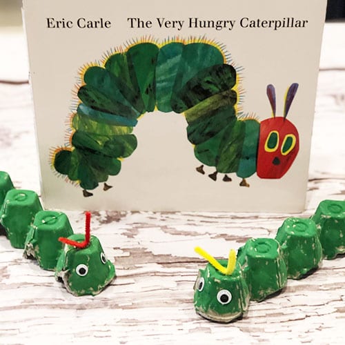 egg carton caterpillars in front of The Very Hungry Caterpillar book in this example of very hungry caterpillar activities
