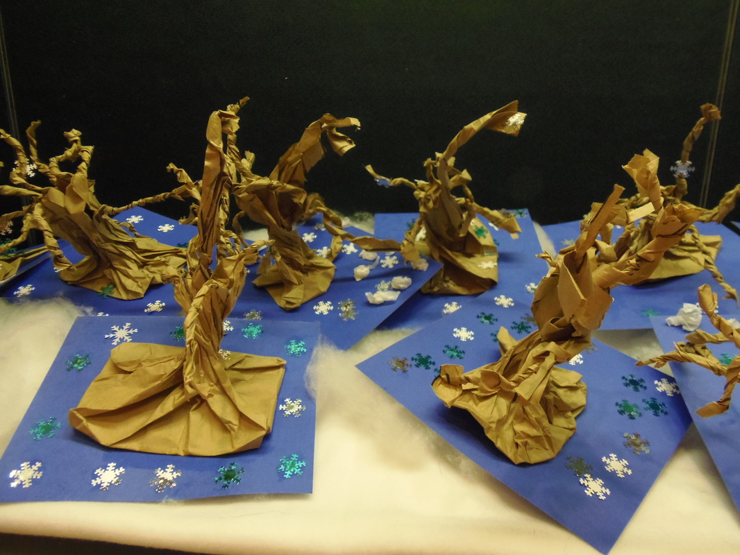 Collection of bare winter trees made by twisting brown paper.